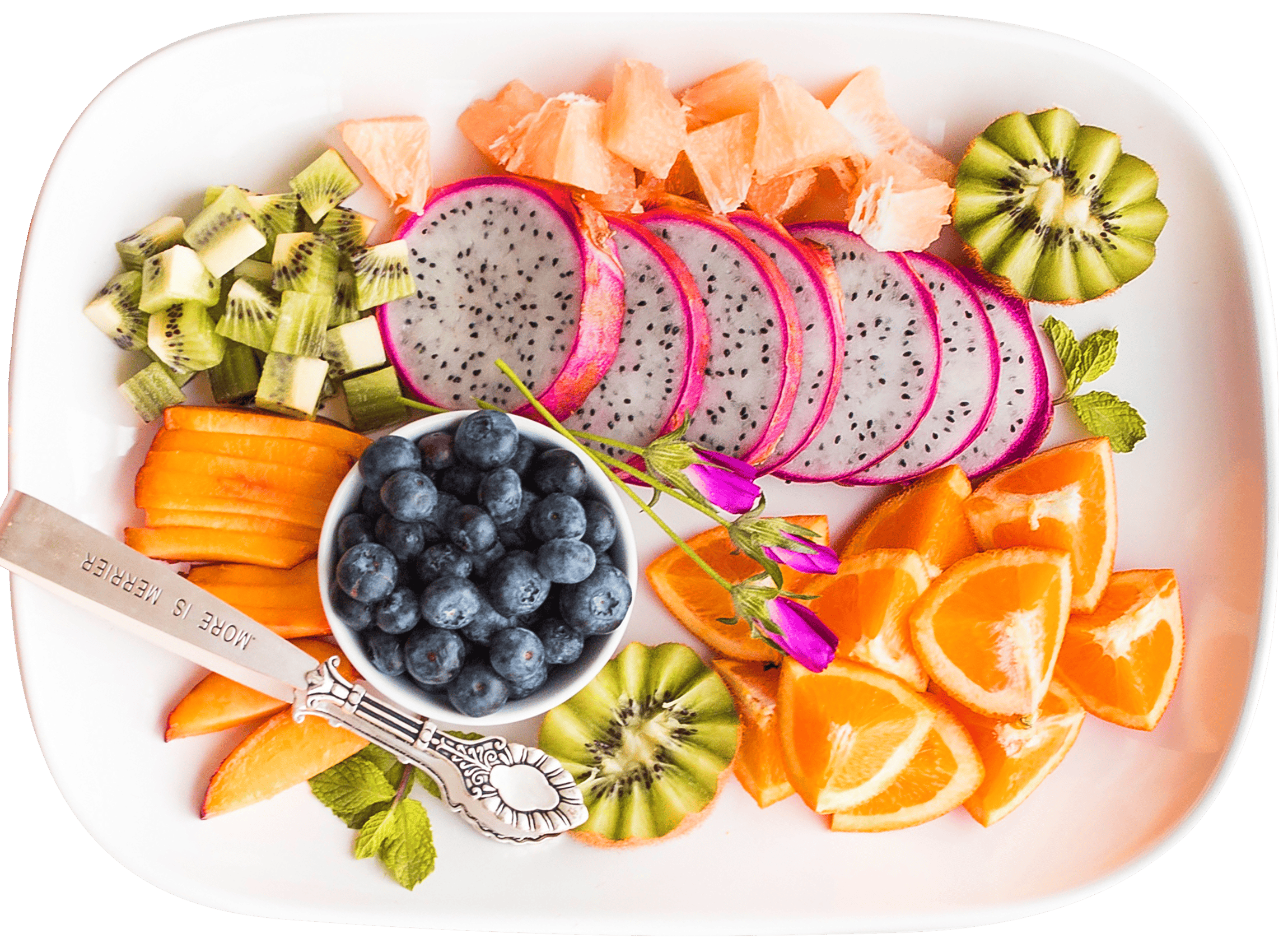 Vibrant tropical fruit platter with dragon fruit and more, shot from above.